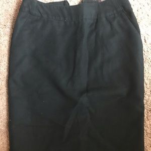 Knee-length black skirt